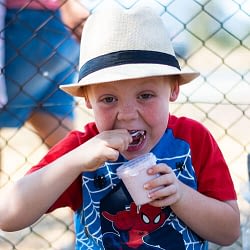 Cute little boy eating NLK's strawberry flavoured gelato