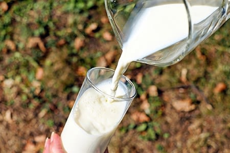 Naughty Little Kids milk poured into a glass